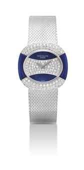 PATEK PHILIPPE. A LADY'S FINE AND VERY RARE 18K WHITE GOLD AND DIAMOND-SET CUSHION-SHAPED BRACELET WATCH WITH LAPIS LAZULI DIAL