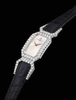 VACHERON CONSTANTIN. A LADY'S FINE AND ELEGANT 18K WHITE GOLD AND DIAMOND-SET CUT-CORNERED RECTANGULAR WRISTWATCH
