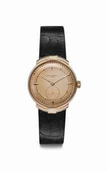 Patek Philippe. A Fine, Unusual and Extremely Rare 18k Pink Gold Wristwatch with Pink Dial