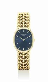 PATEK PHILIPPE. AN ELEGANT 18K GOLD OVAL WRISTWATCH WITH BRACELET AND CERTIFICATE