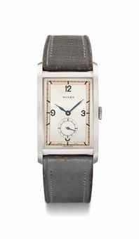 Rolex. A large, very fine and extremely rare stainless steel rectangular wristwatch with three-tone dial