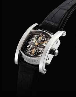 BULGARI. A FINE AND RARE PLATINUM LIMITED EDITION TONNEAU-SHAPED SEMI-SKELETONISED AUTOMATIC PERPETUAL CALENDAR DUAL TIME TOURBILLON WRISTWATCH WITH LEAP YEAR INDICATION