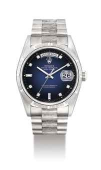 ROLEX. A FINE AND RARE 18K WHITE GOLD AND DIAMOND-SET AUTOMATIC WRISTWATCH WITH SWEEP CENTRE SECONDS, DAY, DATE AND BRACELET