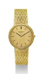 VACHERON CONSTANTIN. AN 18K GOLD WRISTWATCH WITH BRACELET AND LINEN DIAL
