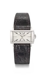 Patek Philippe. A rare 18K white gold rectangular horizontal driver's wristwatch with faceted sapphire crystal