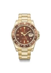 Rolex. A very fine and rare 18K gold dual time automatic wristwatch with sweep centre seconds, date, brown dial and bezel, and bracelet