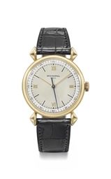 Patek Philippe. A very fine, rare and attractive 18K gold wristwatch with sweep centre seconds, two-tone silvered dial and unusual lugs