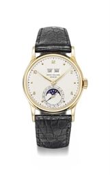 Patek Philippe. A fine 18K gold perpetual calendar wristwatch with phases of the moon