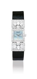 PIAGET. A LADY ’ S 18K WHITE GOLD AND DIAMOND-SET SQUARE WRISTWATCH WITH BLUE MOTHER-OF-PEARL DIAL