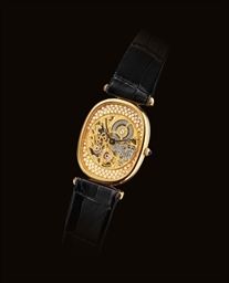 PATEK PHILIPPE. A FINE AND RARE 18K GOLD AND DIAMOND-SET CUSHION-SHAPED SKELETONISED WRISTWATCH