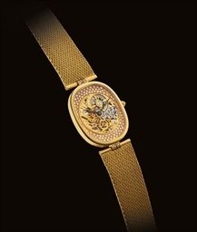 PATEK PHILIPPE. A FINE AND RARE 18K GOLD AND DIAMOND-SET CUSHION-SHAPED SKELETONISED WRISTWATCH WITH BRACELET