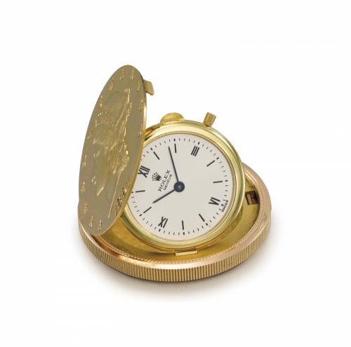 Rolex. A rare 18K gold twenty dollar coin watch