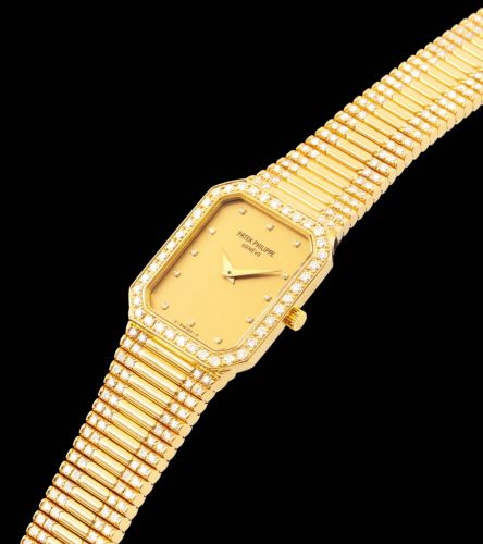 PATEK PHILIPPE. A FINE 18K GOLD AND DIAMOND-SET OCTAGONAL BRACELET WATCH 
