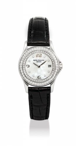 PATEK PHILIPPE. A LADY’S 18K WHITE GOLD AND DIAMOND-SET WRISTWATCH WITH DATE, MOTHER-OF-PEARL DIAL, ORIGINAL CERTIFICATE AND BOX/b