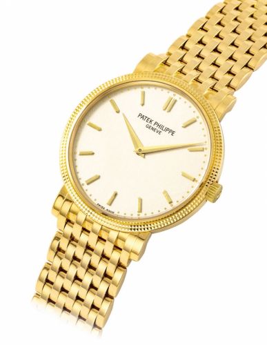 PATEK PHILIPPE. AN 18K GOLD/b bAUTOMATIC WRISTWATCH WITH BRACELET