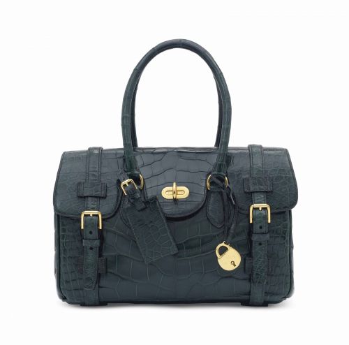 A SHINY EMERALD GREEN ALLIGATOR LEGEND WITH GOLD HARDWARE