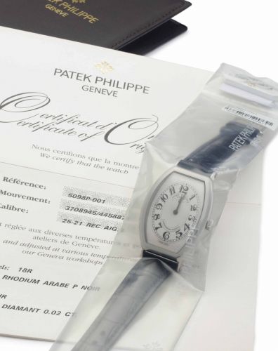 Patek Philippe. A Fine Platinum Tonneau-Shaped Wristwatch, Factory Sealed