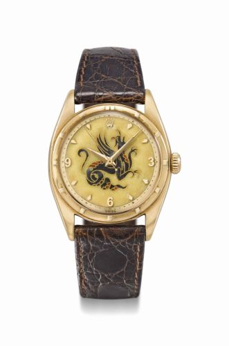Rolex. A highly important and exceptionally rare 18K gold automatic wristwatch with sweep centre seconds and cloisonné enamel dial depicting a dragon by Nelly Richard