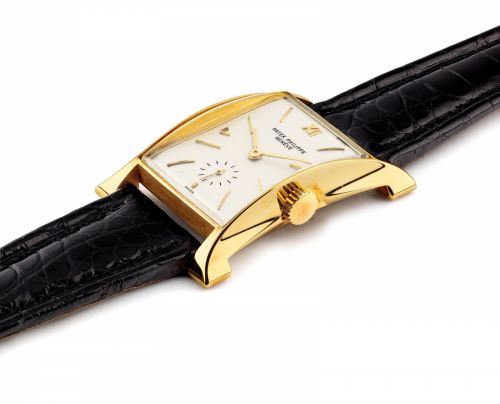 PATEK PHILIPPE. A FINE AND RARE 18K GOLD RECTANGULAR WRISTWATCH 