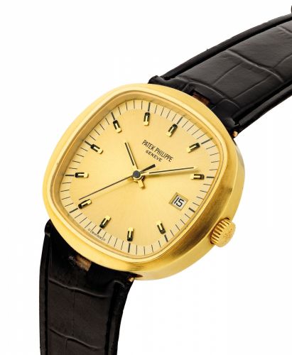 PATEK PHILIPPE. A RARE OVERSIZED 18K GOLD CUSHION-SHAPED ELECTRONIC WRISTWATCH WITH SWEEP CENTRE SECONDS, DATE AND TWO-TONE GILT DIAL