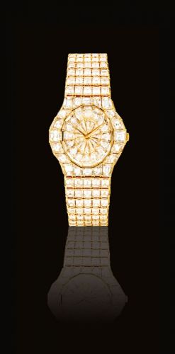 PIAGET. A MAGNIFICENT, VERY RARE AND IMPRESSIVE 18K GOLD AND DIAMOND-SET BRACELET WATCH