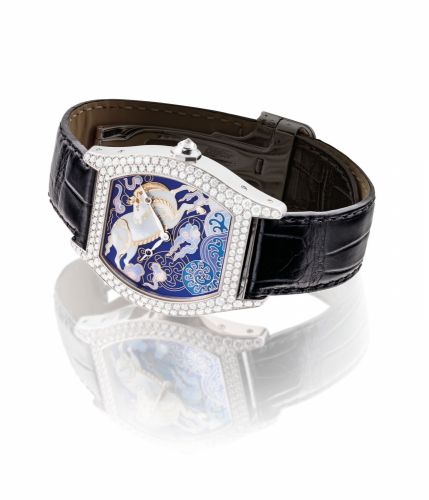 CARTIER. A FINE, VERY RARE AND ATTRACTIVE LIMITED EDITION 18K WHITE GOLD AND DIAMOND-SET TONNEAU-SHAPED WRISTWATCH WITH ENAMEL DIAL