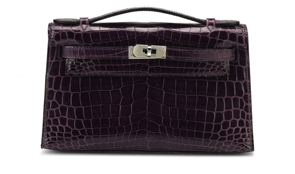 A SHINY AMÉTHYSTE NILOTICUS CROCODILE KELLY POCHETTE WITH PALLADIUM HARDWARE HERMÈS, 2010