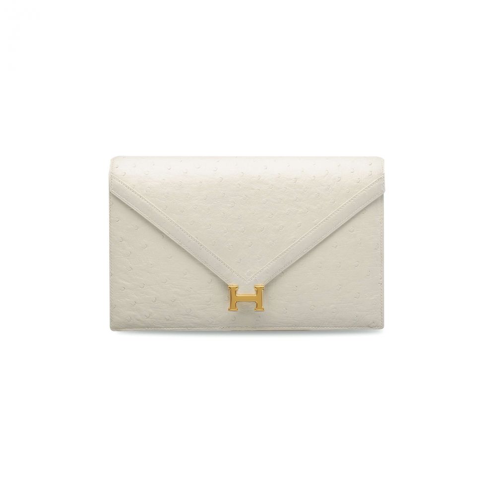 A WHITE OSTRICH LYDIE WITH GOLD HARDWARE