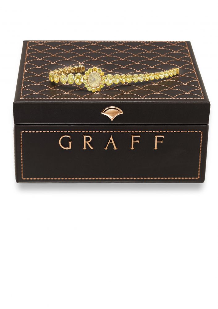 GRAFF. A MAGNIFICENT 18K GOLD AND FANCY VIVID YELLOW DIAMOND SET LADY’S QUARTZ WRISTWATCH WITH,INTEGRAL FANCY VIVID YELLOW DIAMOND SET BRACELET AND BOX