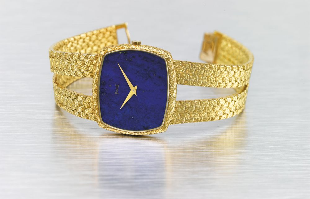 PIAGET. A VERY FINE AND ELEGANT 18K GOLD AND HARD STONE BRACELET WATCH