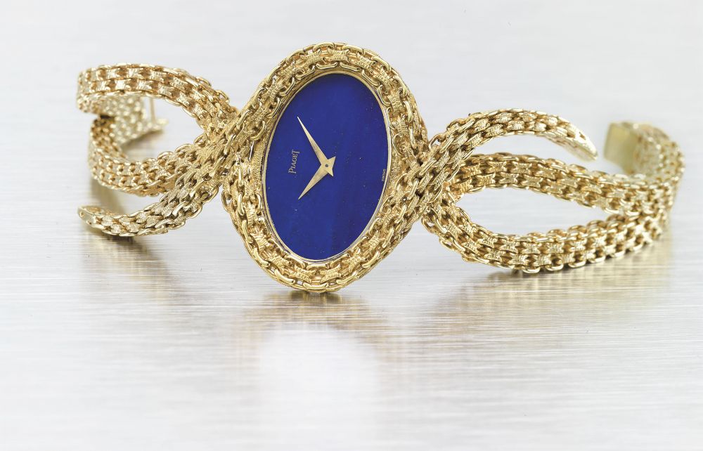 PIAGET. A VERY FINE AND ELEGANT 18K GOLD AND LAPIS LAZULI BRACELET WATCH