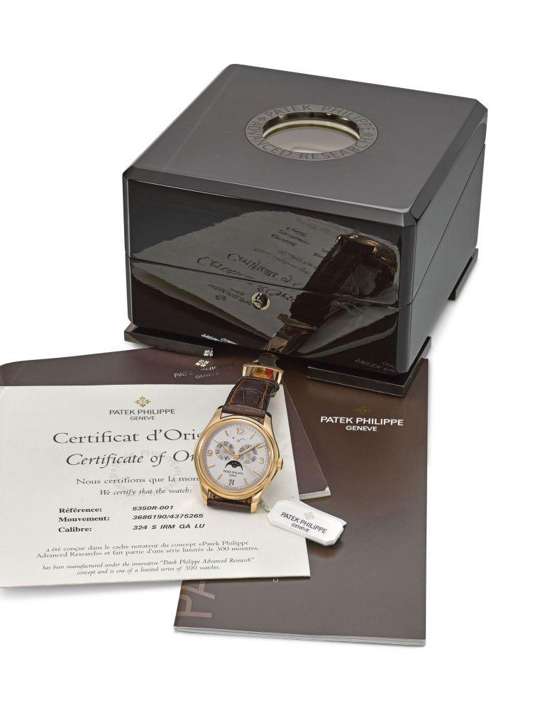 PATEK PHILIPPE. A FINE AND RARE 18K PINK GOLD LIMITED EDITION AUTOMATIC ANNUAL CALENDAR WRISTWATCH WITH SWEEP CENTRE SECONDS, POWER RESERVE INDICATION, MOON PHASES, ORIGINAL CERTIFICATE AND BOX