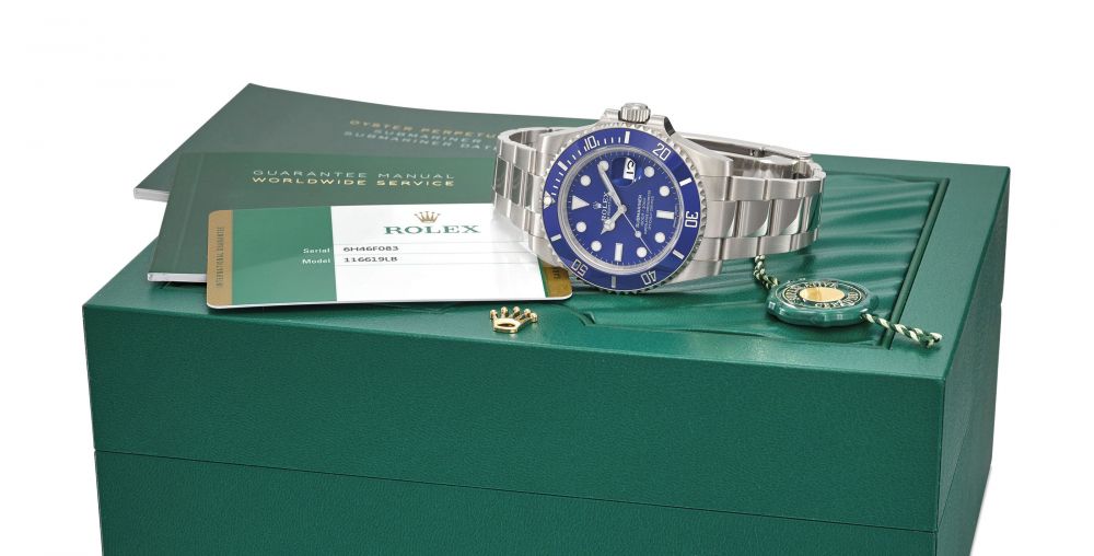 ROLEX. AN 18K WHITE GOLD AUTOMATIC WRISTWATCH WITH DATE, SWEEP CENTRE SECONDS, BRACELET, ORIGINAL GUARANTEE AND BOX