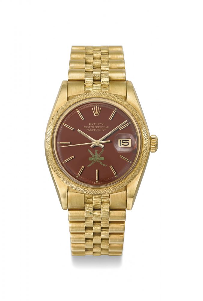 Rolex. A very fine, rare and attractive 18K gold automatic wristwatch with sweep centre seconds, date and chocolate brown lacquered Stella dial with green Khanjar, made for the Sultanate of Oman
