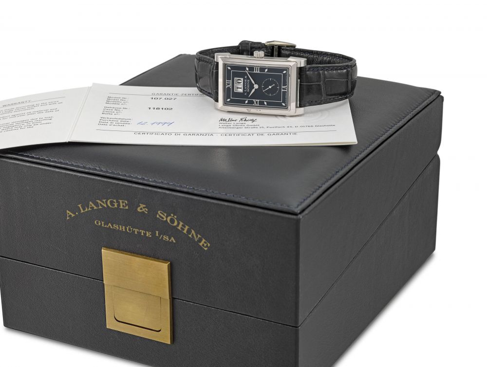 A. LANGE & SÖHNE. A VERY FINE AND RARE 18K WHITE GOLD RECTANGULAR WRISTWATCH WITH OVERSIZED DATE, ORIGINAL GUARANTEE AND BOX