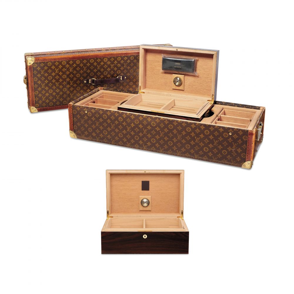 A CLASSIC MONOGRAM LIBRARY TRUNK MADE FOR THE ENCYCLOPAEDIA BRITANNICA MODIFIED AS A HUMIDOR, WITH BRASS HARDWARE