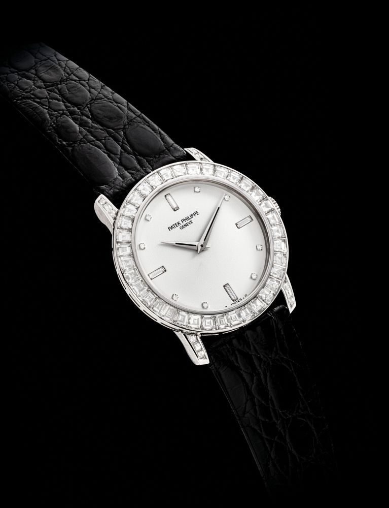 PATEK PHILIPPE. A FINE AND RARE PLATINUM AND DIAMOND-SET WRISTWATCH