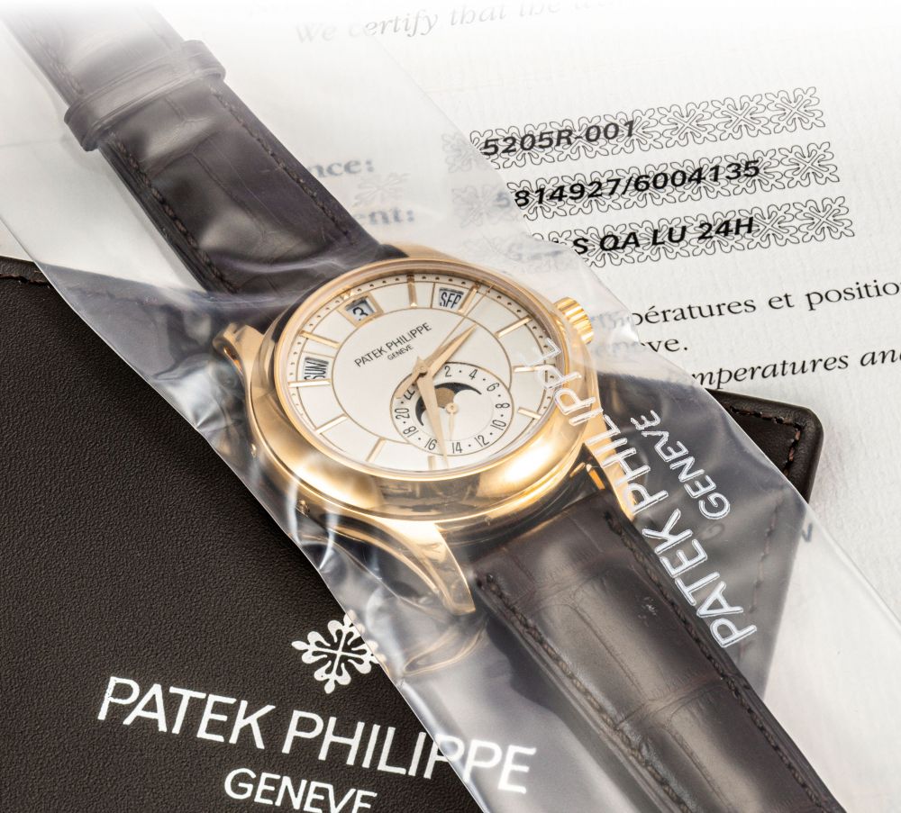 PATEK PHILIPPE. A FINE 18K PINK GOLD AUTOMATIC ANNUAL CALENDAR WRISTWATCH WITH SWEEP CENTRE SECONDS, MOON PHASES AND 24 HOUR INDICATION