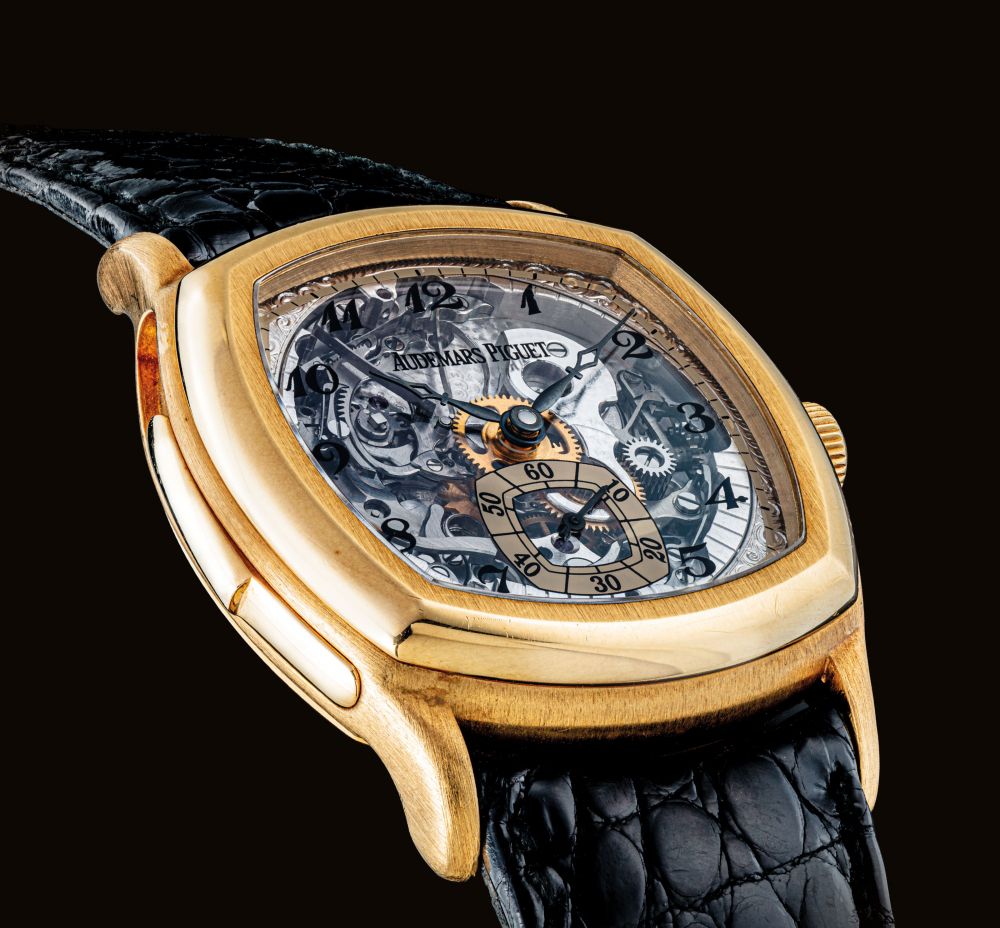 AUDEMARS PIGUET. A VERY FINE AND RARE 18K GOLD CUSHION-SHAPED SKELETONISED MINUTE REPEATING WRISTWATCH