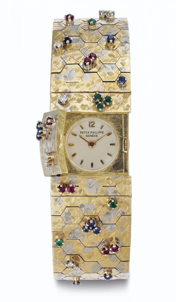 Patek Philippe. A Very Attractive 18k Yellow and White Gold, Ruby, Sapphire and Emerald-set Ladies Bracelet Watch