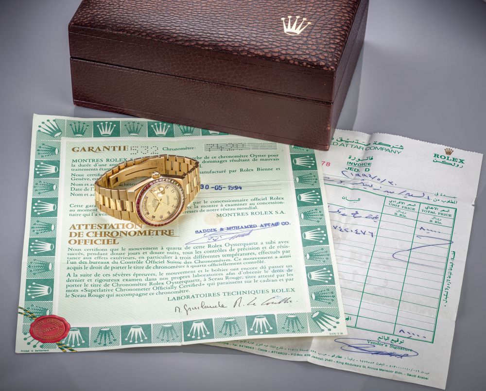 ROLEX. AN EXTREMLY RARE AND ATTRACTIVE 18K GOLD AND MULTI-COLOURED GEM-SET WRISTWATCH WITH SWEEP CENTRE SECONDS, DATE, DAY, MULTI-COLOURED GEM-SET DIAL, BRACELET, ORIGINAL GUARANTEE, INVOICE AND BOX