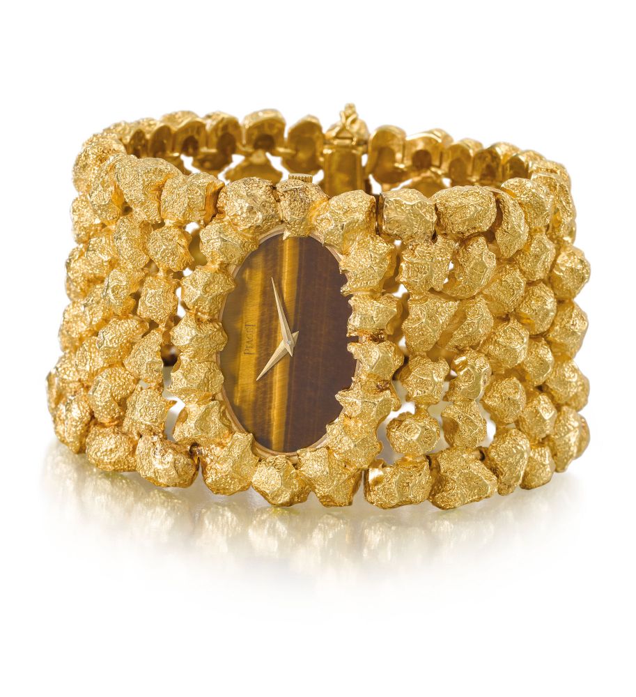 Piaget. An extremely rare and highly attractive, heavy 18K gold bracelet watch with tiger’s eye dial