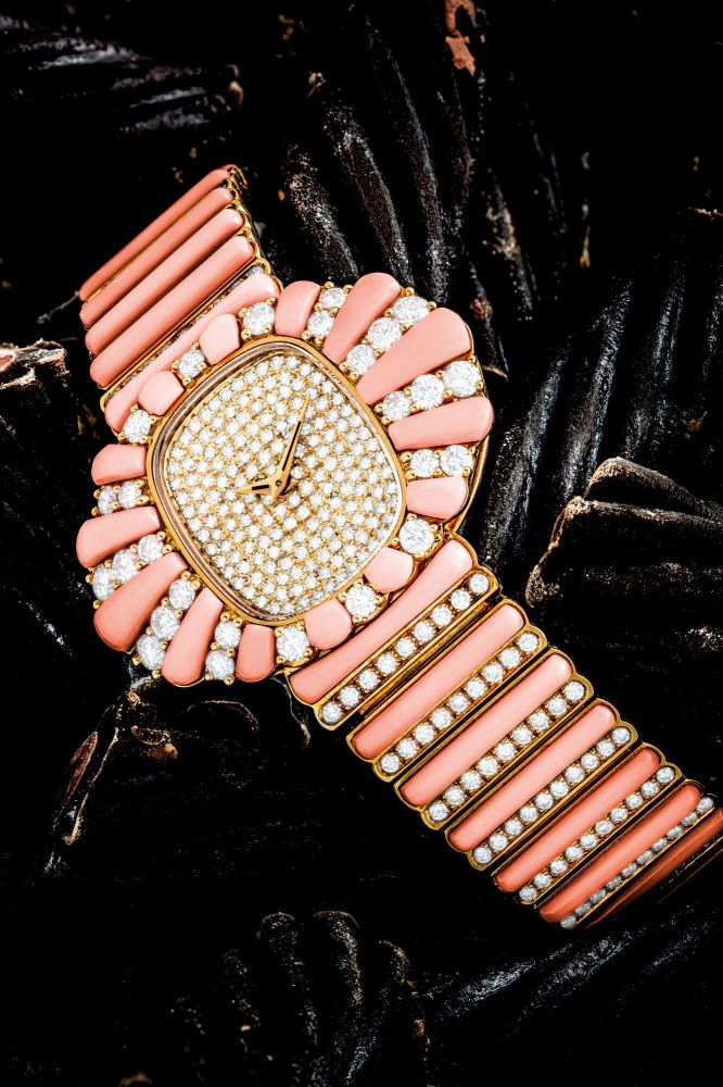 PATEK PHILIPPE. A LADY’S GORGEOUS AND POSSIBLY UNIQUE 18K GOLD AND DIAMOND-SET BRACELET WATCH WITH CORAL