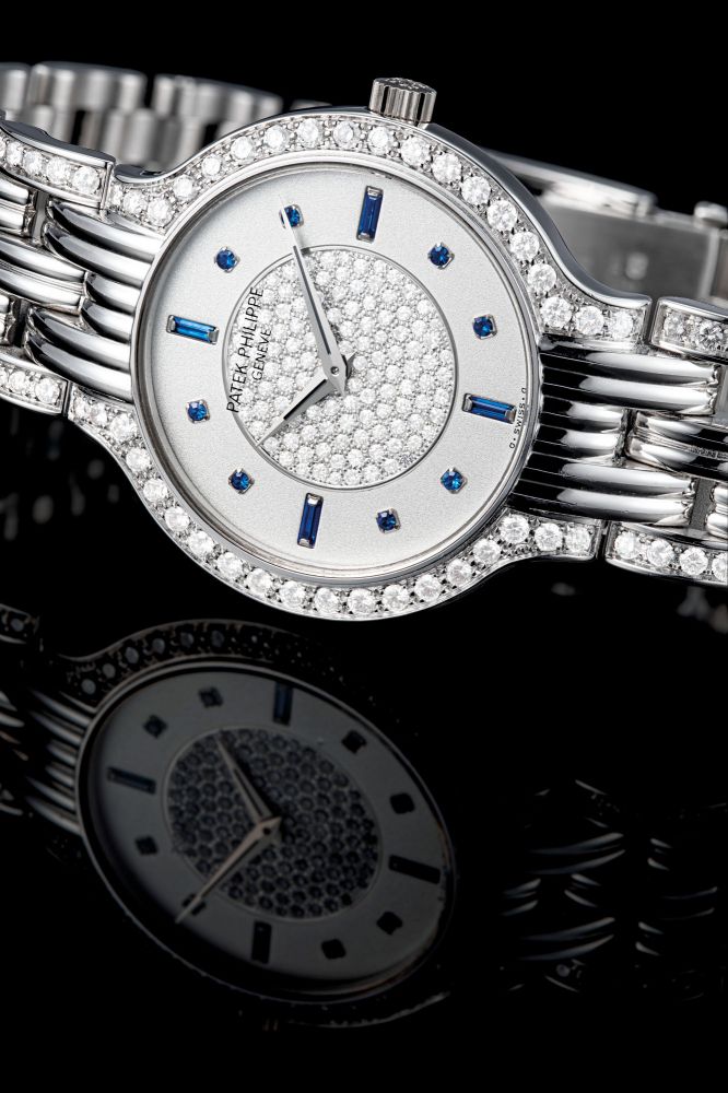 PATEK PHILIPPE. AN 18K WHITE GOLD, DIAMOND AND SAPPHIRE-SET BRACELET WATCH
