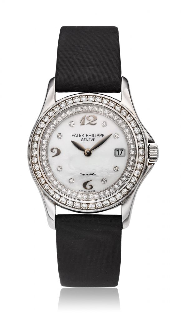 PATEK PHILIPPE, TIFFANY & CO. MOTHER OF PEARL DIAL, CALATRAVA, 18K WHITE GOLD & DIAMONDS, REF. 4906 -
