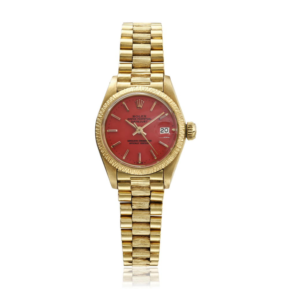 ROLEX, A LADY'S YELLOW GOLD DATEJUST WITH RED STELLA DIAL, REF.6927 -
