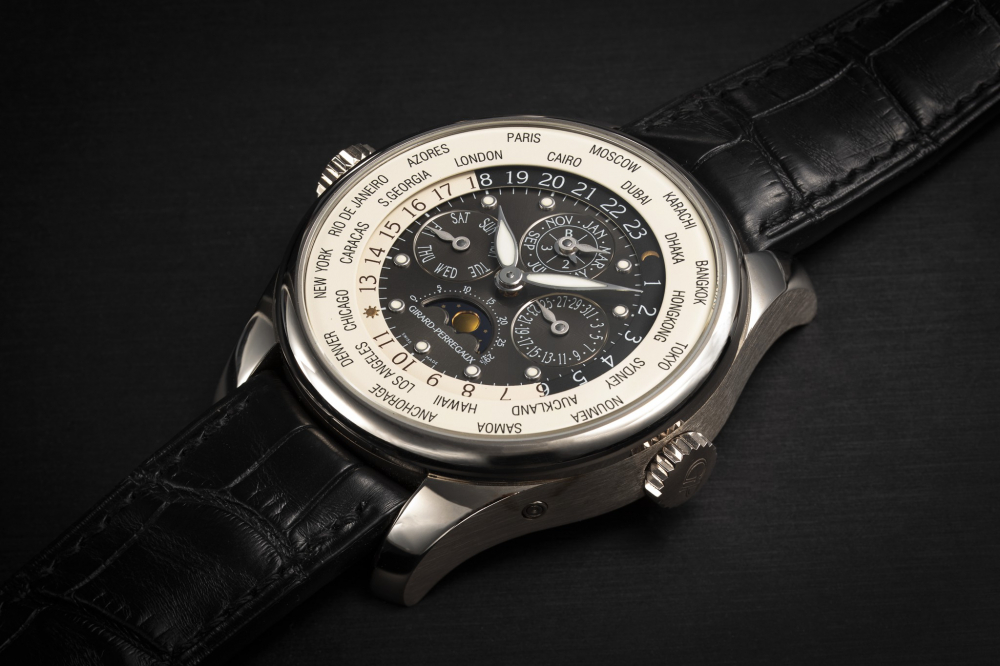 GIRARD-PERREGAUX, WW.TC REF. 90280, A GOLD AUTOMATIC WORLD TIME PERPETUAL CALENDAR WRISTWATCH - CASE