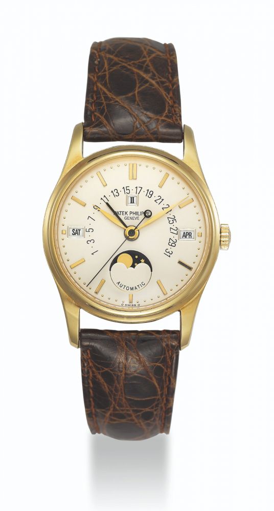 PATEK PHILIPPE, GOLD PERPETUAL CALENDAR WITH MOON PHASES AND RETROGRADE DATE, REF. 5050J - NO. 1'957'019, CASE NO. 2'947'103