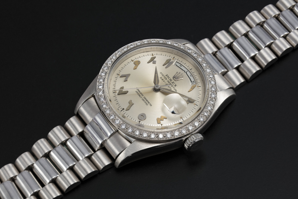 ROLEX SCHEHERAZADE REF. 1804, A PLATINUM OYSTER PERPETUAL DAY-DATE WITH DIAMOND-SET BEZEL AND ARABIC CALENDAR AND NUMERALS - CASE