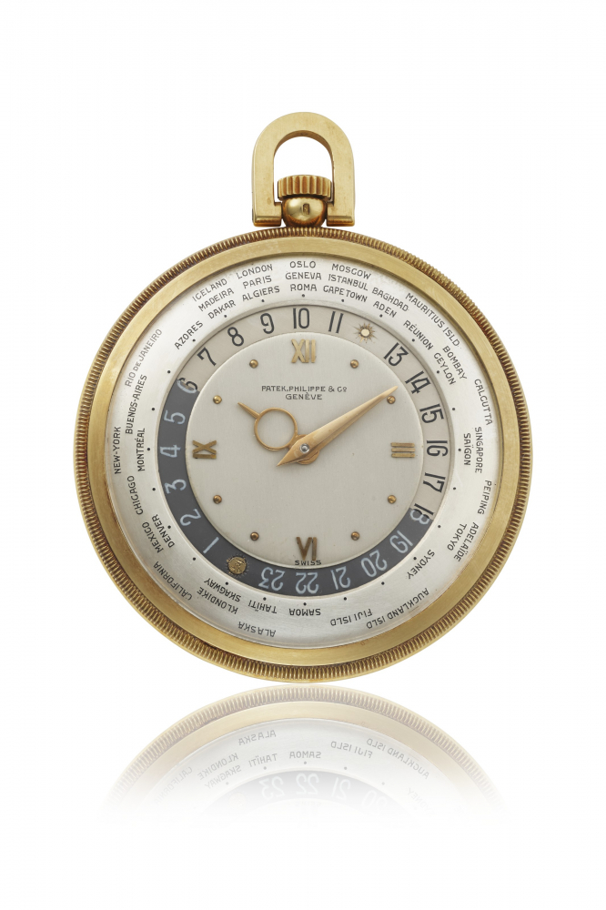 PATEK PHILIPPE. A FINE AND RARE 18K GOLD OPENFACE KEYLESS LEVER WORLD TIME WATCH WITH LATER ENGRAVED COAT OF ARMS